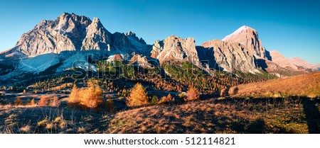 Panorama from top of Falzarego pass with Lagazuoi mountain. Colorful autumn morning in Dolomite Alps, Cortina d'Ampezzo lacation, Italy, Europe. Artistic style post processed photo.
