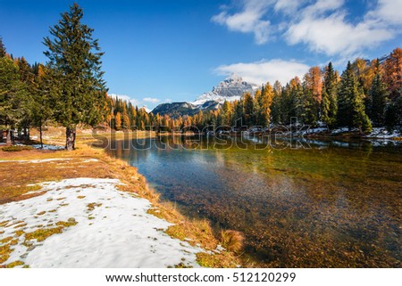 Sunny morning scene on Antorno lake. Colorful autumn landscape in National Park Tre Cime di Lavaredo, Dolomite Alps, South Tyrol. Location Auronzo, Italy, Europe. Artistic style post processed photo.
