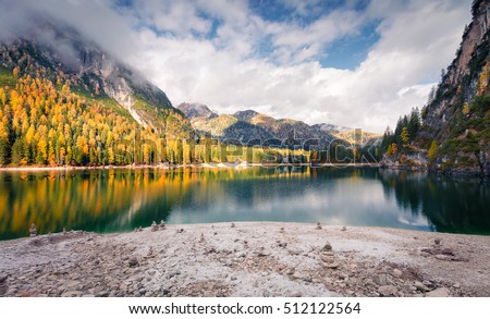 Beautiful morning on Braies Lake. Colorful autumn landscape in Italian Alps, Naturpark Fanes-Sennes-Prags, Dolomite, Italy, Europe. Artistic style post processed photo.