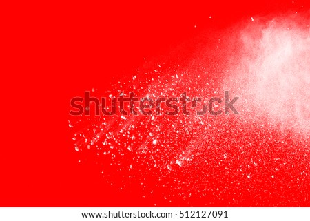 Abstract design of white powder cloud against red background