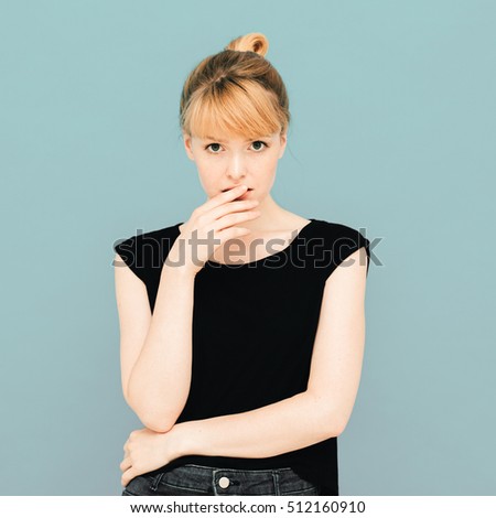 Happy beautiful woman young posing emotional on gray background
