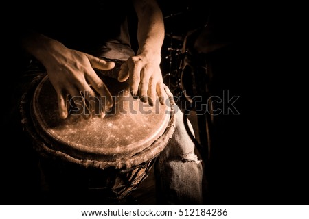 People hands playing music at djembe drums, France Royalty-Free Stock Photo #512184286