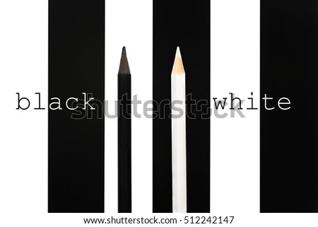 Black and white pencil standing out from crowd on b/w stripe background. business success concept of leadership an uniqueness,independence, initiative,strategy, dissent, think different
