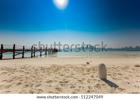 View of a coast on a very hot day in Bahrain- shot with lens flare to show the intensity of the scorching sun