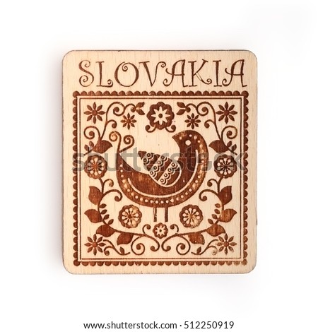 Magnetic souvenir from Slovakia with the image of a traditional ornament isolated on white background