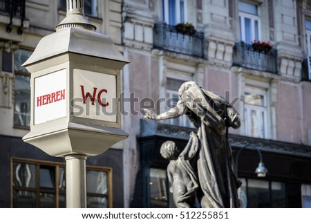 Historic toilet sign in a street of Vienna Austria