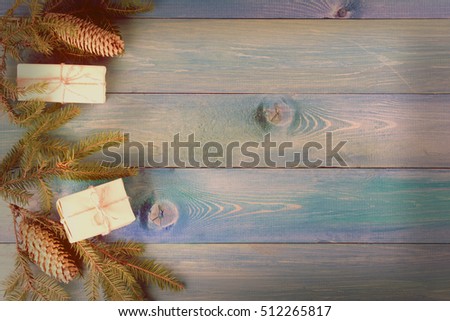 Christmas wooden grunge rustic background - vintage planked wood with Christmas fir tree and free ad text space. Toned photo