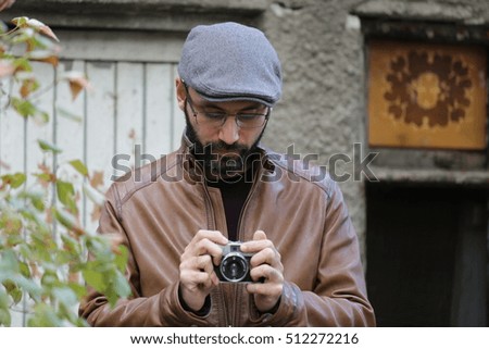 happy young man with camera