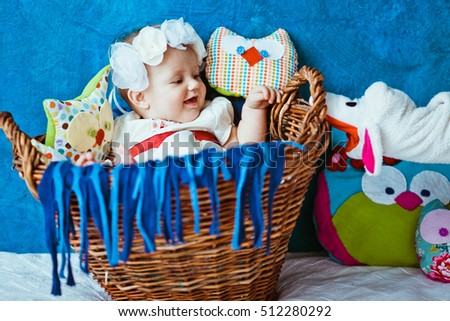 The baby lies in the basket