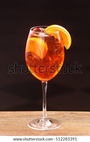 Spritz in glass, close up on black background