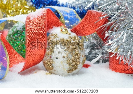 colorful christmas decorations over snow