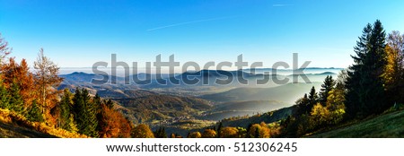 Aerial view of colorful autumnal mountains, foggy sunset, Vosges, Alsace, France Royalty-Free Stock Photo #512306245
