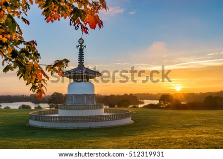 Peace Pagoda temple at sunrise in Willen Park, Milton Keynes, UK Royalty-Free Stock Photo #512319931
