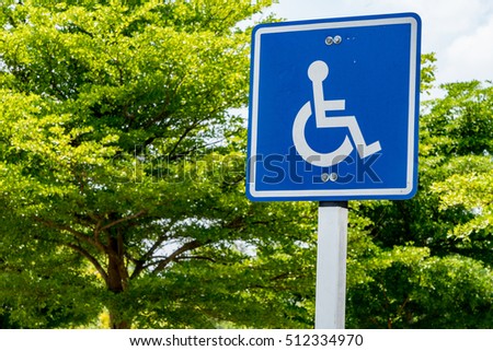 Blue handicapped sign in the park