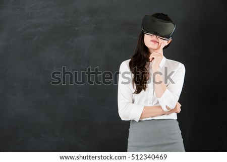 asian woman teacher question thinking with virtual reality. VR headset glasses device. blackboard background. school and education concept