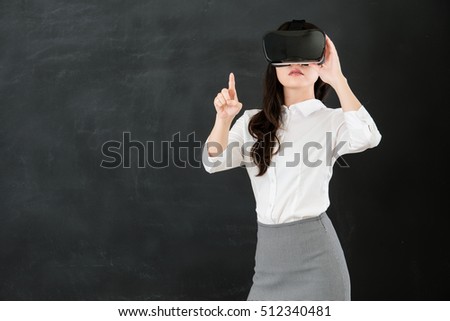 asian woman teacher touch screen with virtual reality. VR headset glasses device. blackboard background. school and education concept