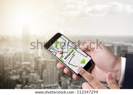 person holding a smartphone on blurred cityscape background
