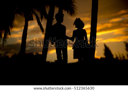 Silhouette of a couple in love at sunset.