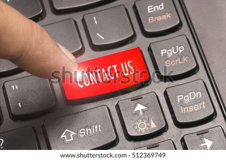Contact Us word on red keyboard button.