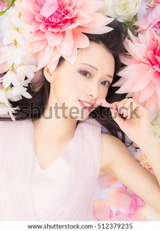 cute Japanese girl smiling, surrounded by flowers