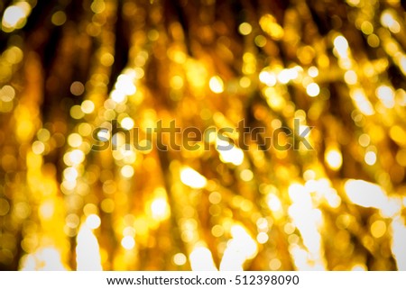 Gold and yellow Christmas Glittering. Holiday abstract texture Festive background with defocused Golden bokeh