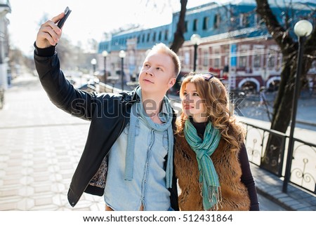 couple is doing selfie on smartphone