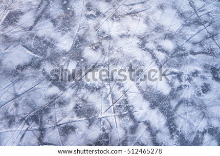 Winter background with snow and ice on ice skating rink