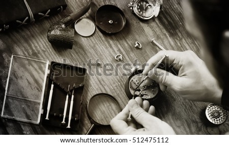 black and white photo watch clock repairing