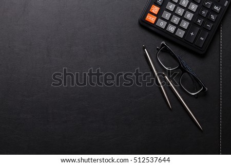 Office leather desk table with calculator, pen and pencil. Top view with copy space