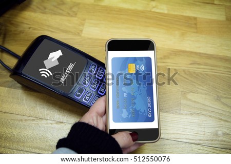 NFC Near field communication concept: Male hands using smart phone to made payment. All graphics are made up