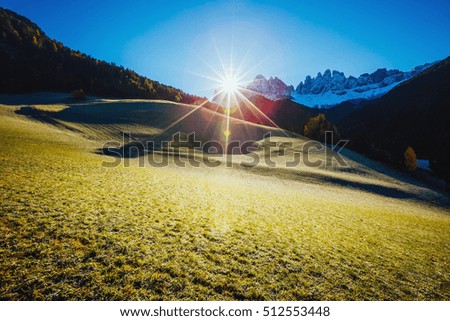 Vivid view of the alpine hill that glowing by sunlight. Great and gorgeous morning scene. Popular tourist attraction. Location place Funes valley, Dolomites. South Tyrol. Italy, Europe. Beauty world.