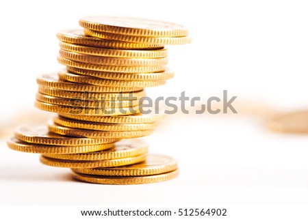Coins stacked on each other in different positions. Money concept.