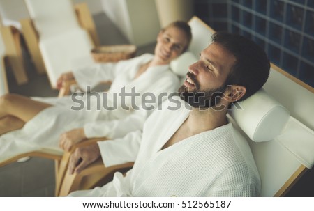 Beautiful couple relaxing in spa center Royalty-Free Stock Photo #512565187