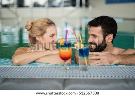 Couple enjoying cocktail in resort wellness  bath