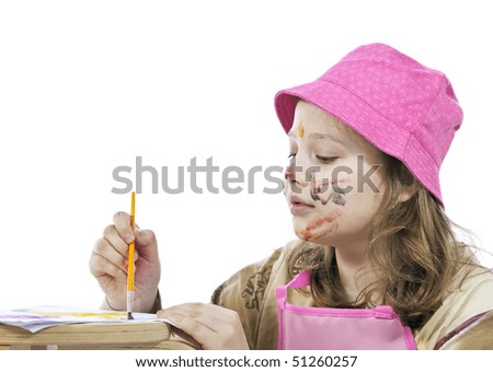 The girl with painting face in a pink cap do a view of picture  by coloring