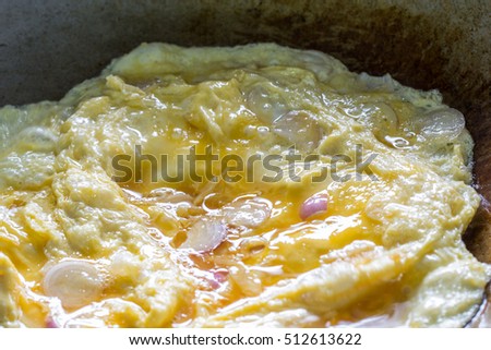 egg omelet in steel pan