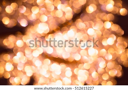 Shimmering blur spot light on orange color background, Christmas concept