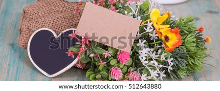 Bouquet of flowers with blank paper tag