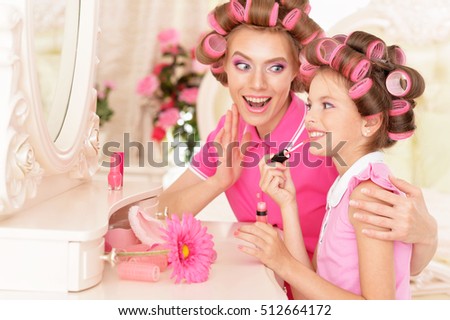  Mother and daughter in hair curlers