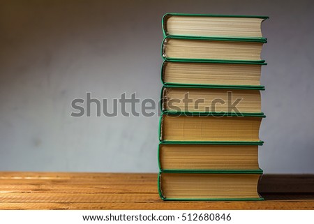 a collection of books in the volumes containing the story on their pages and wealth knowledge hidden inside / a rich collection of books 