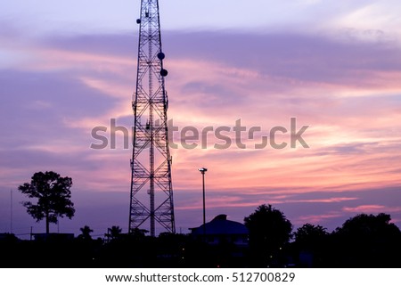 silhouette Telecommunication tower on sky background at sunset