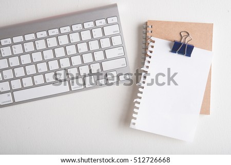 blank torn note paper on white wooden table