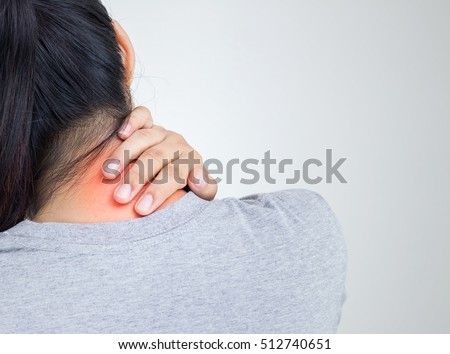 Young woman feeling exhausted and suffering from neck pain, Health concept. Royalty-Free Stock Photo #512740651