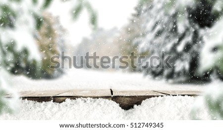 wooden desk space and snow decoration of winter time 