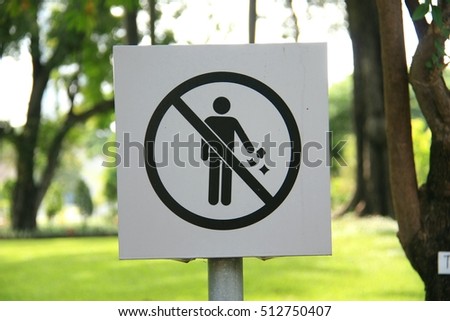 Signs prohibiting littering, symbol plate with garden background
