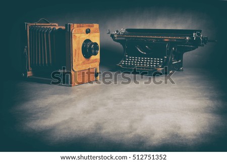 Antique Typewriter and old wooden camera