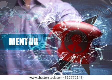 Business, Technology, Internet and network concept. Young businessman breaks the virtual future of the screen on which the inscription: mentor