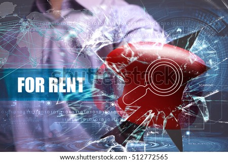 Business, Technology, Internet and network concept. Young businessman breaks the virtual future of the screen on which the inscription: for rent