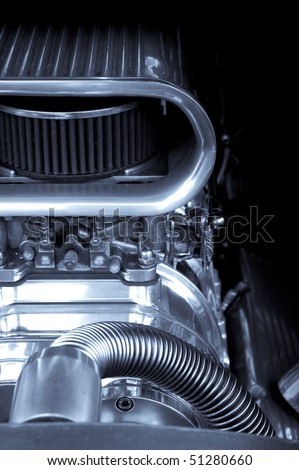 chromed engine supercharger on a performance race car Royalty-Free Stock Photo #51280660