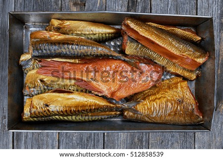 Set of smoked fish in a tin pan